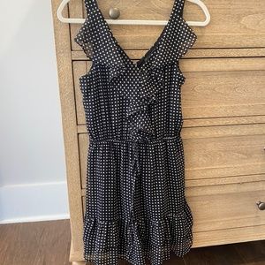 Black and white polka dot ruffle tank dress with tie waist